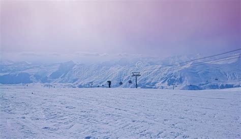 Majestic Snowy Peaks Landscape And Pink Sky In Sunset Rays Of Sun