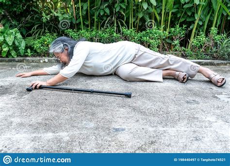 Elderly Asian Woman Falling Lying On The Road Floor She Is A Patient Of Osteoarthritis Stock