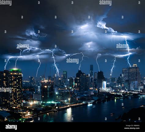 Lightning Storm Over City In Blue Light Stock Photo Alamy
