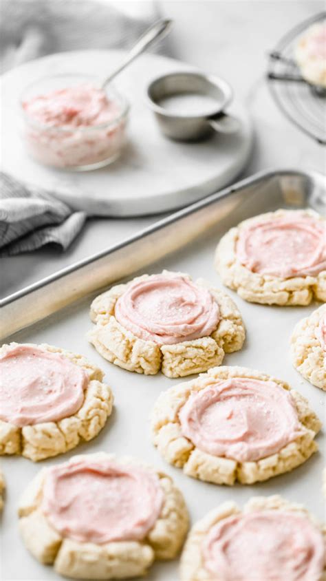 these soft frosted sugar cookies are so delicious and delicate they have a cream cheese
