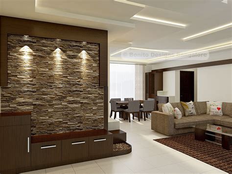 To draw the eye to a feature piece. Amazing foyer with stone cladding | Cladding design, Stone ...