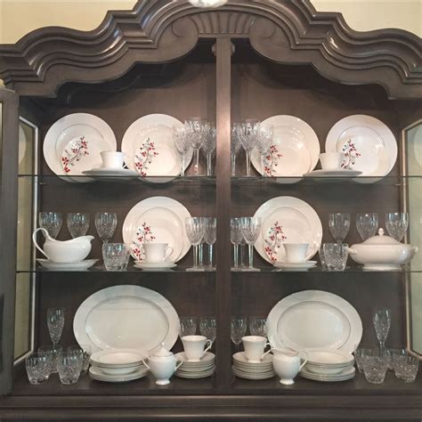 Arrange pretty plates and bowls into stacks and line up mugs in neat rows. china & crystal in china cabinet/hutch. I had a hard time ...