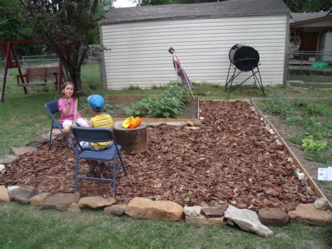 I was thinking of using the branches to make a wood chip and doing this under the cork trees, which are moist and shaded. Backyard makeover on a budget - One Mama's Daily Drama