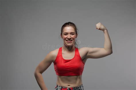 Portrait Of Smiling Strong Girl Showing Biceps Stock Image Image Of