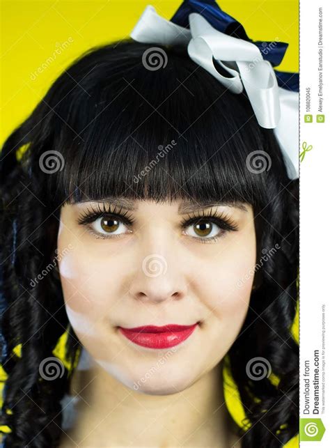 Girl Brunette In A Blue Dress On A Yellow Background Stock Image Image Of Fashion Model