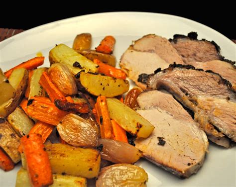 Place the pork on top of the potato mixture and transfer to the oven. Slow Roasted Pork Loin, Potatoes, Carrots