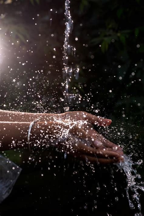 Human Hand Under Pouring Water · Free Stock Photo