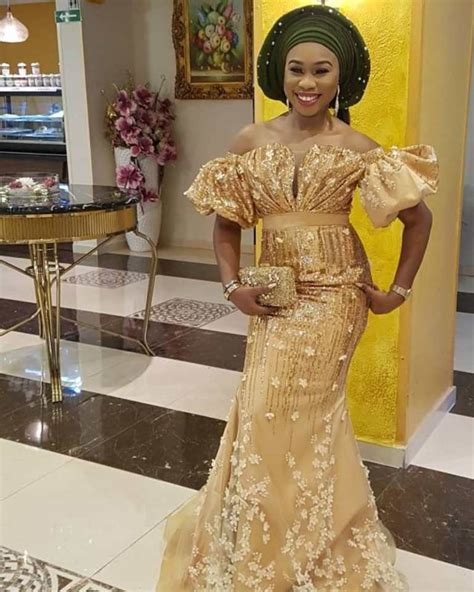 Aso Ebi Styles 134 Dripping In Gold Kamdora Lace Dress Styles