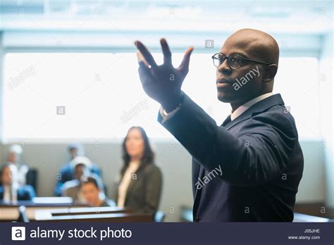 Male Attorney Gesturing Talking In Legal Trial Courtroom Stock Photo