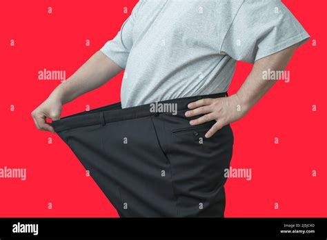 The Man Pulls On His Big Pants At The Waist Shows How He Lost Weight