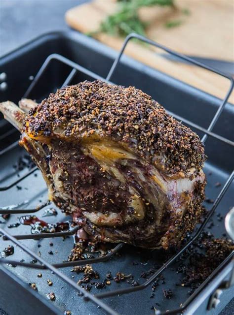 Most people cook cook the prime rib at a low temperature, between 225 degrees f and 325 degrees f, until the meat reaches an internal temperature of 115 degrees f. Garlic Rosemary Peppercorn Prime Rib Roast - A Zesty Bite