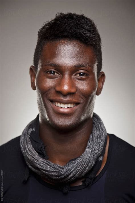 Portrait Of A Normal Black Man Smiling by BONNINSTUDIO