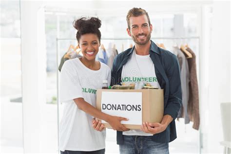 Smiling Young Couple With Clothes Donation Stock Photo Image Of