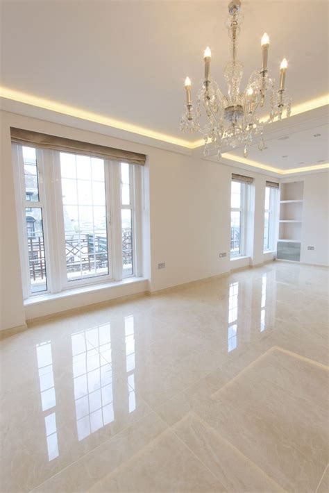 Elegant Penthouse Living Room With Glossy Floor Tiles With A Marble