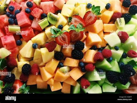 A Large Fruit Tray Of Cut Up Watermelon Cantaloupe Honeydew Stock