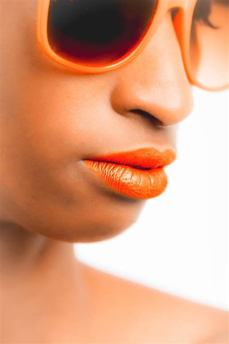 Free Photo Woman Wearing Orange Framed Sunglasses And Orange Lipstick