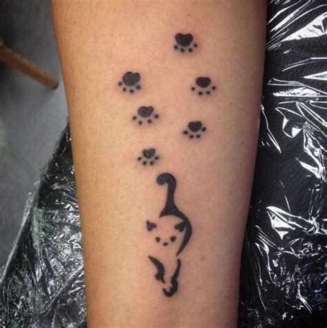 You may choose to incorporate your dog's name into your tattoo, his date of birth, or perhaps a heart if your dog has already passed. 30 Best Cat Paw Print Tattoo Designs - Page 5 - The Paws