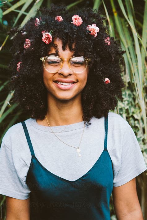 Portrait Of A Beautiful Mixed Race Woman With Flowers In Her Hair Del