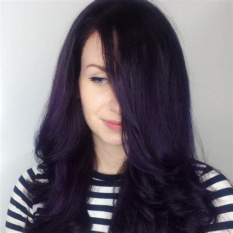This deep, rich hair color has an intense midnight blue hue that brings a cool edge to black hair. Deep Purple Black Hair With Purple Tint