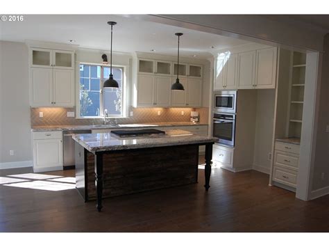 How high should a kitchen ceiling be? I love the kitchen cabinets that go all the way to the ...