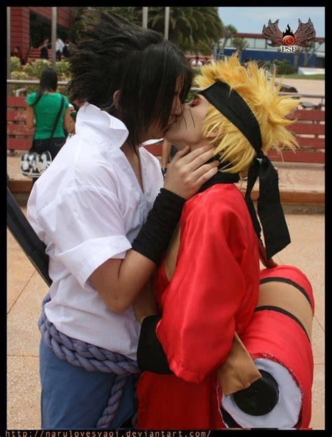 two people dressed as anime characters kissing each other
