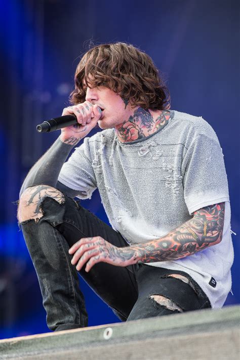 Sykes has dark brown colored hair and hazel colored eyes. File:2016 RiP Bring Me the Horizon - Oliver Sykes - by ...