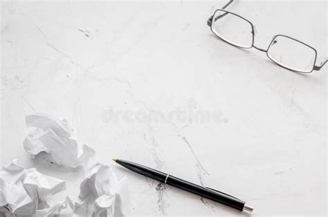 Blogger Office Desk With Glasses Pen And Paper Balls On Stone