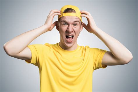 Although someone may wear a hat every. Stressful Teenager Screaming With Anger And Keeps Hands On ...