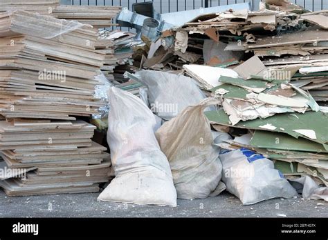 Construction Waste Is Piled Up At Site After Building Repair Removal