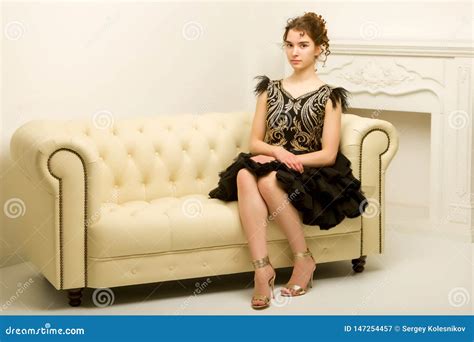 Teen Girl In Elegant Dress Sitting On The Couch Stock Image Image Of