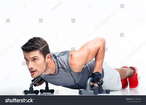 Fitness Young Man Doing Push Ups Isolated On A White Background