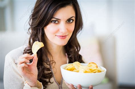 Woman Eating Potato Chips Stock Image C0346006 Science Photo Library