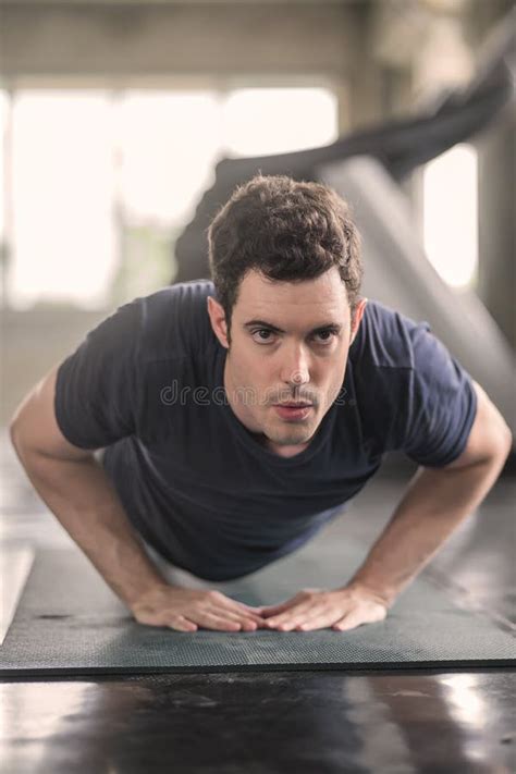 Handsome Man And Strong Guy Doing Push Ups Exercise In Fitness Gym
