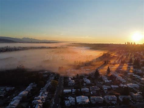 Aerial View Of A Foggy Sunrise Sky Over The Skyline Of Burnaby
