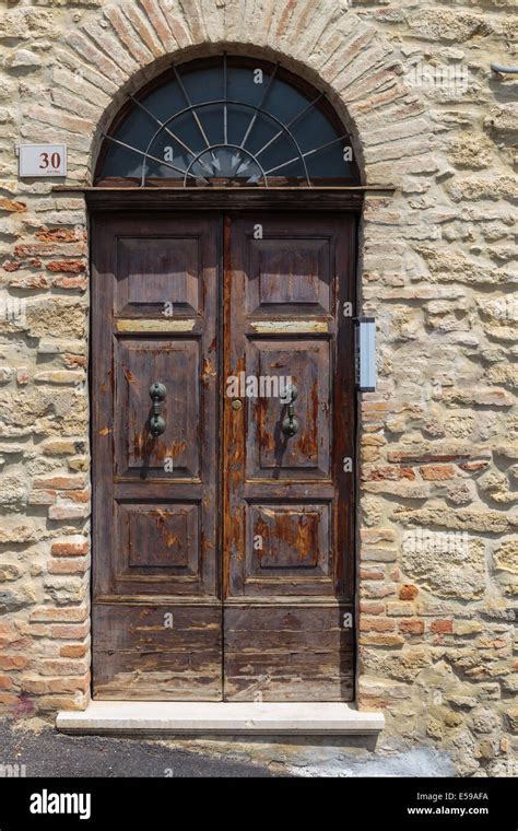 Old Wooden Door In A Stone House Italian Stock Photo Alamy