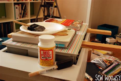 I used my mod podge brush to apply a heavy coat of fabric mod podge to the fabric on the top side. Mod Podge File Cabinet Make-Over - Sew Woodsy