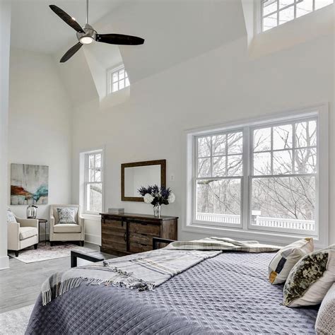 Team with sheer curtains hung from a pole that extends either side of the windows so they can be swept right back. Bedroom Windows Provide Light & Architectural Intrigue | Pella