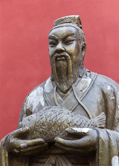 Statue of Chinese Man Holding Fish in Beijing Stock Photo - Image of ...