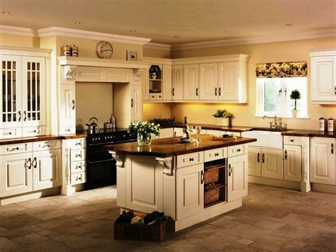 The model boasted a gray kitchen with adjacent light cream beverage center. Image result for cream colored cabinets with brown glaze ...
