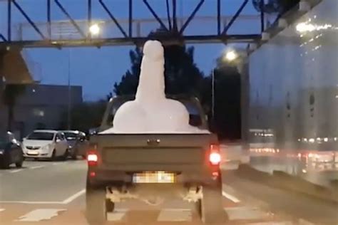 Giant Snow Penis Spotted Travelling Through City Streets As Bemused Couple Follow It Thinking It