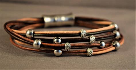 Women Leather Bracelet With Different Browns Strings Of Leather And Stering Silver And Stainless