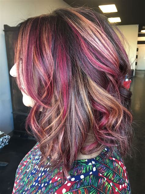 Multidimensional hair color. Balayage. Red highlights. Blonde