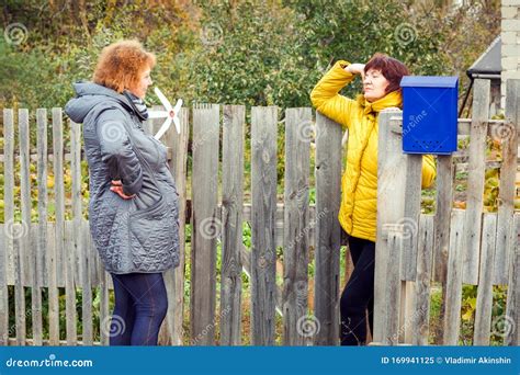A Lively Conversation Between Two Neighbors Stock Image Image Of