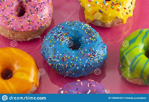 Batch Of Rainbow Colored Glazed Donuts Stock Image Image Of Sprikles