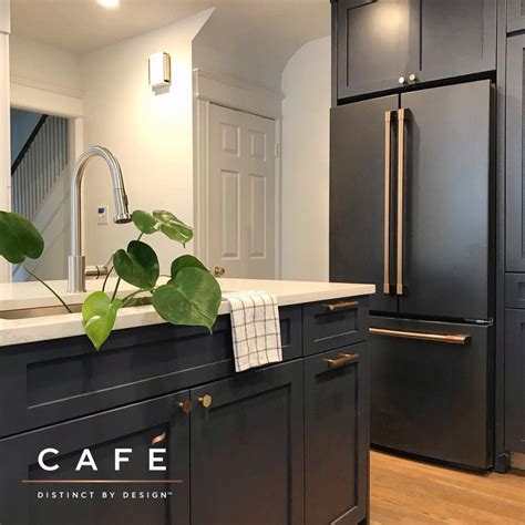 We have everything you are looking for! The moody dark cabinetry and matte black Café appliances ...