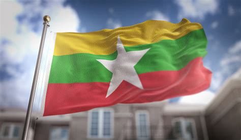 Rendering 3d Bendera Myanmar Di Latar Belakang Gedung Langit Biru Foto