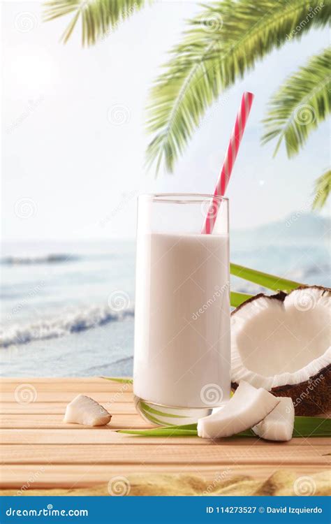 Coconut Milk In Containers And Fruit On The Beach Vertical Stock Image
