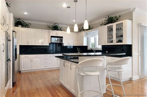 A black and white kitchen décor is a classic style that never goes out of date, making it the ideal choice for people who are not too enthusiastic about changing just because the kitchen décor uses black and white colors does not mean you should stick to the absolute whites and darkest blacks. Pictures of Kitchens - Traditional - White Kitchen ...