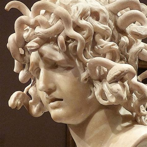 A Close Up Of A Statue With Many Hair On It S Head