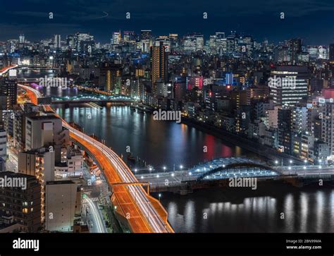 Aerial Night Panoramic View Of The Sumida River Bridges And Higways